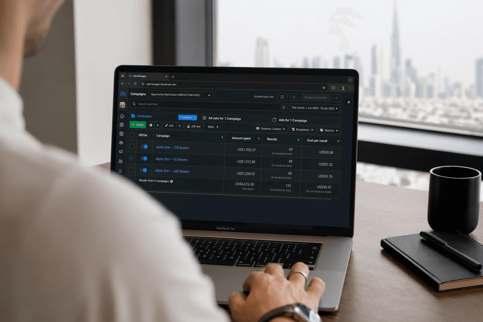 Alpha Star Dubai dashboard — MacBook showing Meta Ads Manager real-estate campaigns